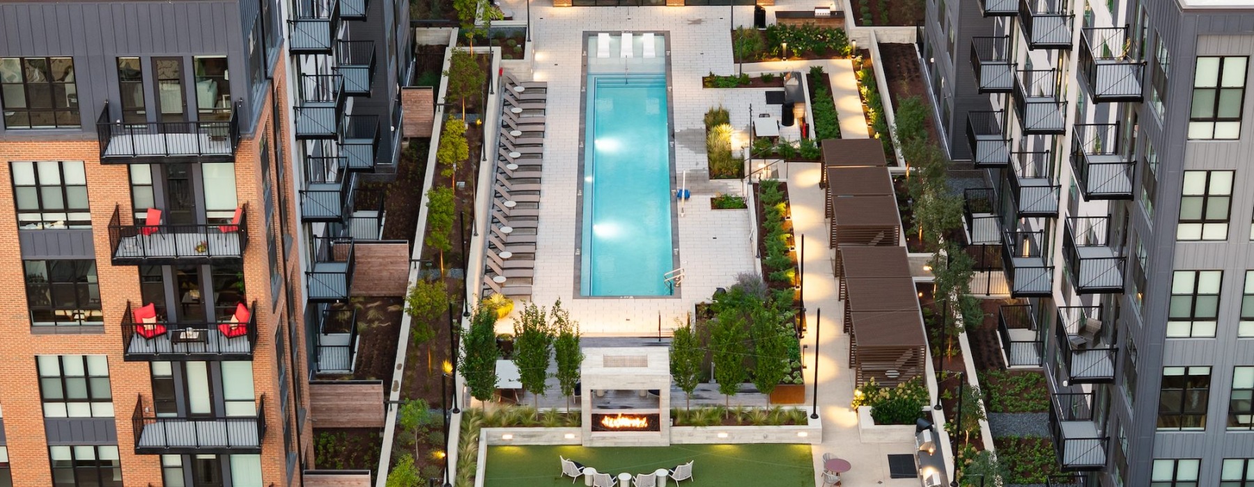 am aerial view of a rooftop pool and deck