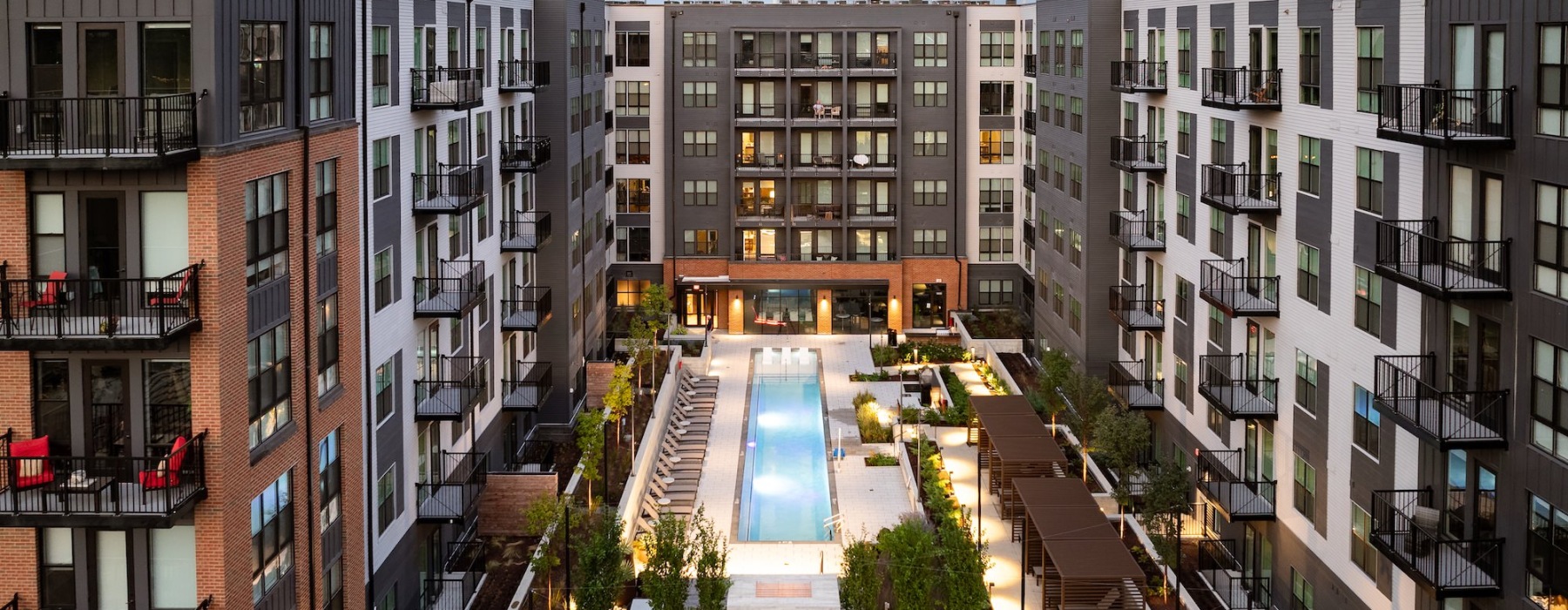 Resort-style swimming pool with lounge seating